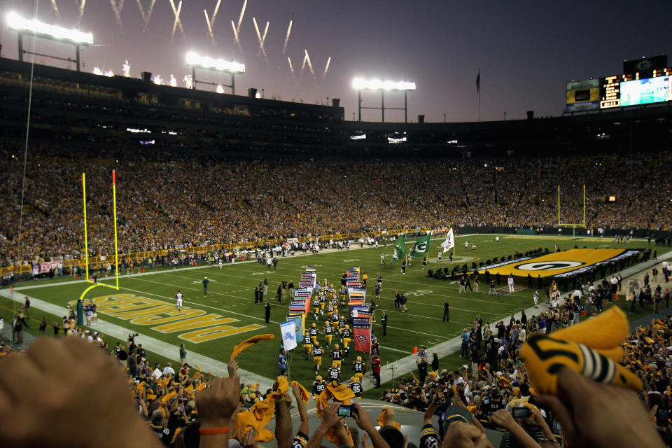 GREEN BAY, WI - SEPTEMBER 08: The Green Bay Packers run onto the field before taking on the New Orleans Saints in the season opening game at Lambeau Field on September 8, 2011 in Green Bay, Wisconsin. (Photo by Jonathan Daniel/Getty Images)