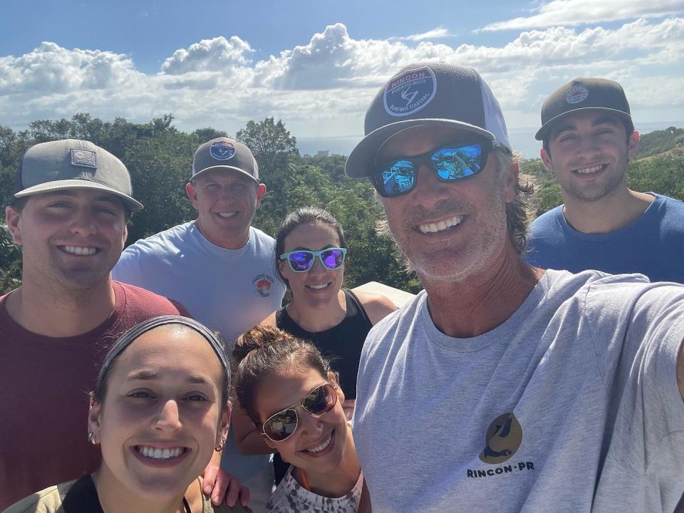 The families of local baseball coaches Eric Frink and Matt Hillis vacation together in Puerto Rico each winter, their trips centered around surfing.