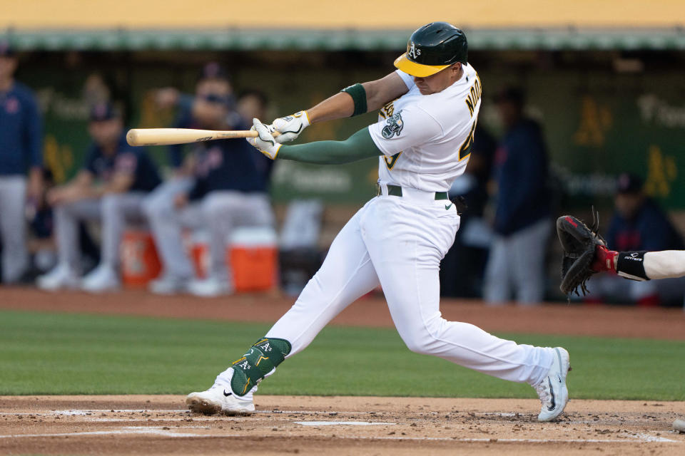 Jul 17, 2023; Oakland, California, USA;  Oakland Athletics first baseman Ryan Noda (49) hits a single during the first inning against the Boston Red Sox at Oakland-Alameda County Coliseum. Mandatory Credit: Stan Szeto-USA TODAY Sports