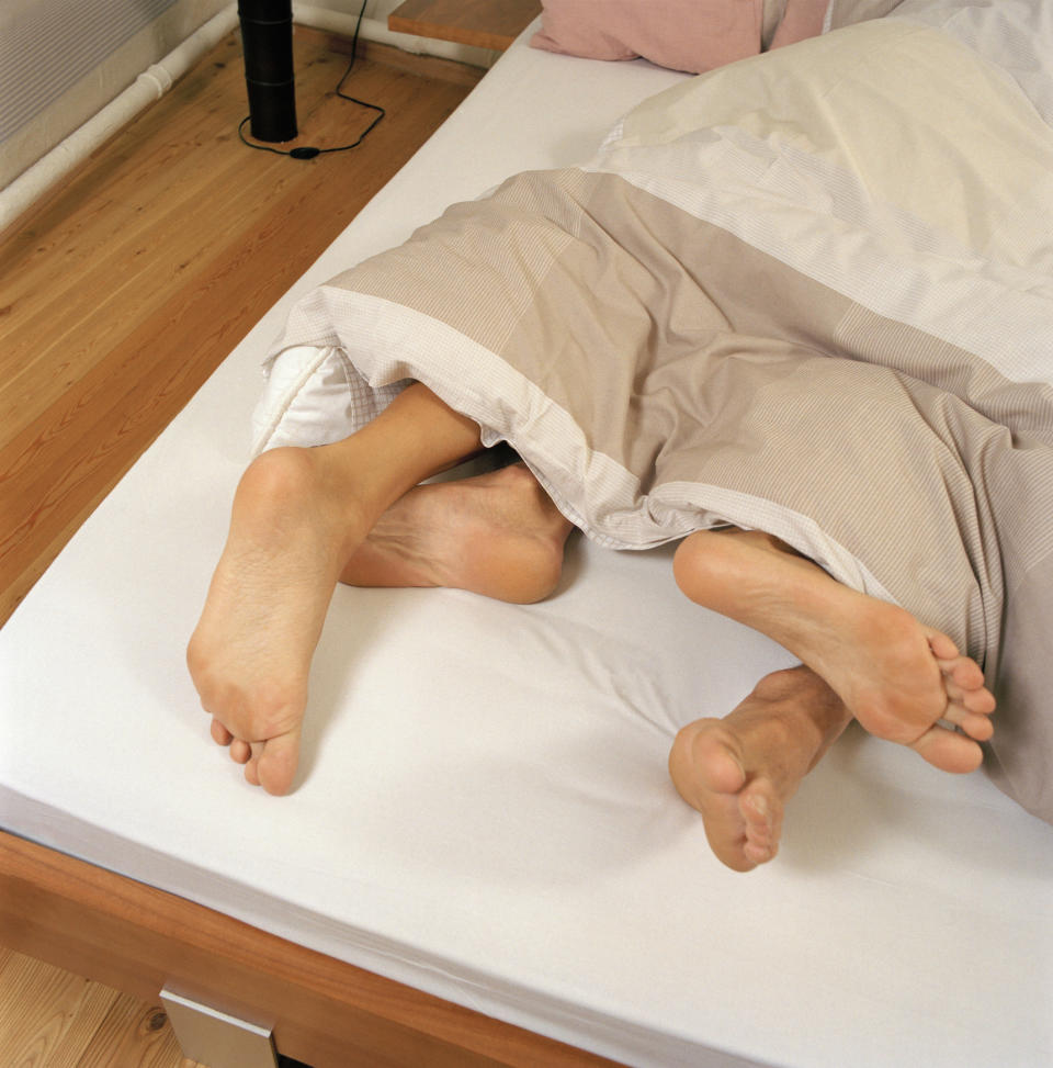 <em>Sticking your feet out of the duvet will help cool you down, according to sleep expert Professor Jason Ellis (Picture: Getty)</em>