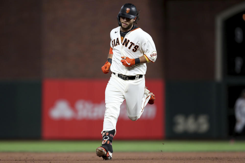 San Francisco Giants' Brandon Crawford rounds the bases after hitting a home run against the Arizona Diamondbacks during the fourth inning of a baseball game in San Francisco, Thursday, Sept. 30, 2021. (AP Photo/Jed Jacobsohn)