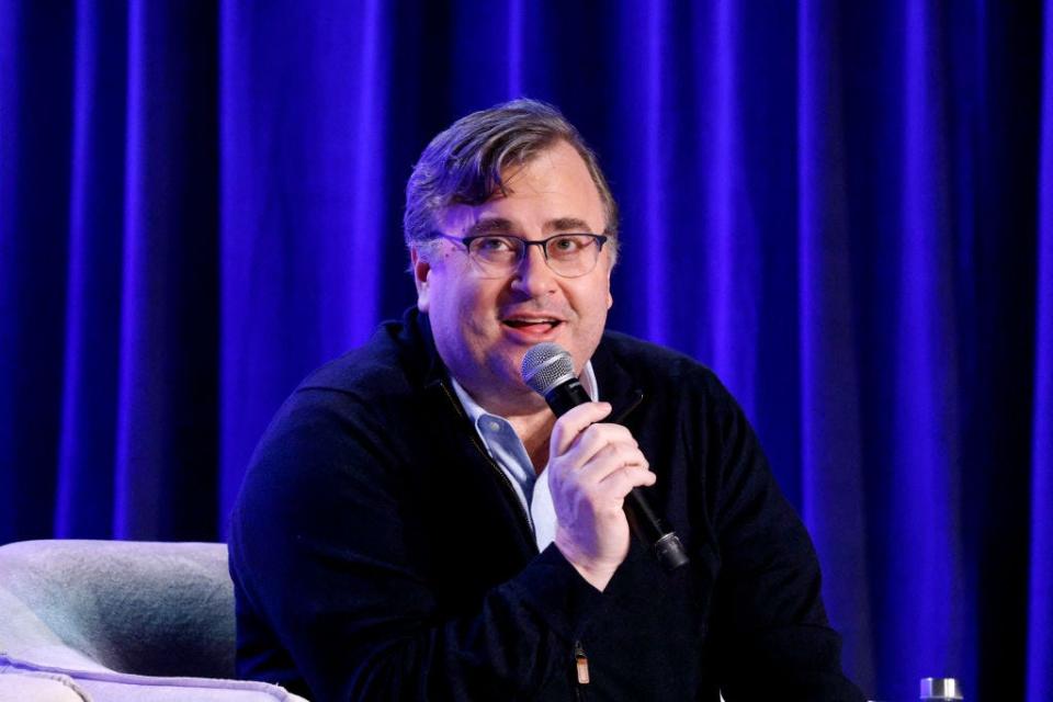 Reid Hoffman speaking into a mic