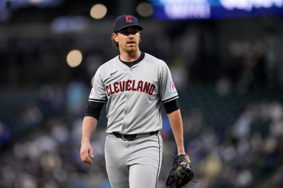 Cleveland Guardians starting pitcher Shane Bieber walks back to the dugout after facing the Seattle Mariners during the first inning of a baseball game Tuesday, April 2, 2024, in Seattle. (AP Photo/Lindsey Wasson)