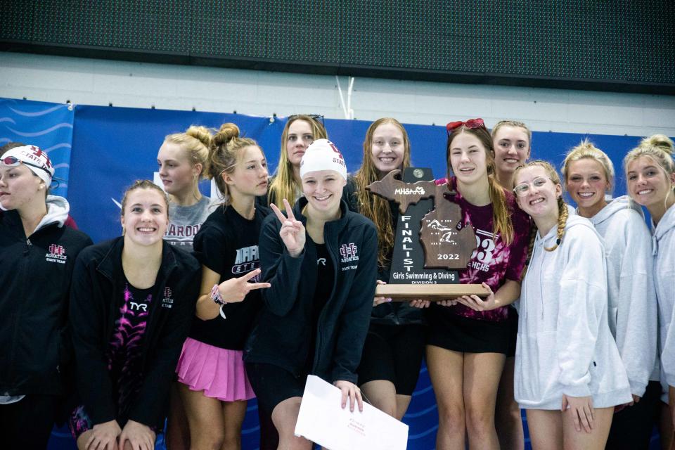 Holland Christian takes home the second place trophy during the D3 State Championships Saturday, Nov. 19, 2022, at The Holland Aquatic Center.