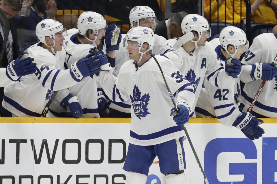 Toronto Maple Leafs defenseman Rasmus Sandin (38), of Sweden, is congratulated after scoring a goal against the Nashville Predators in the second period of an NHL hockey game Monday, Jan. 27, 2020, in Nashville, Tenn. (AP Photo/Mark Humphrey)