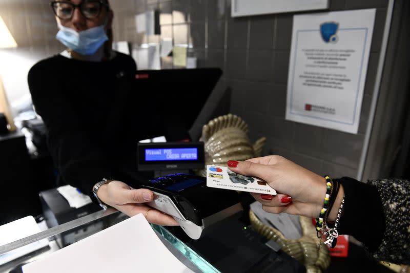 FILE PHOTO: Cash vs card payments in Milan