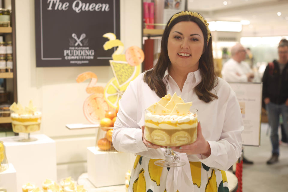 Jemma Melvin in Fortnum and Mason, central London, with her lemon Swiss roll and amaretti trifle that beat 5,000 desserts to become the official pudding of the Queen's Jubilee celebrations. Picture date: Friday May 13, 2022.