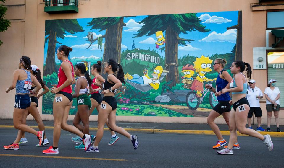 Competitors in the women's 20K racewalk make their way past the Simpson's mural in downtown Springfield during the U.S. Olympic Track and Field Trials in 2021.