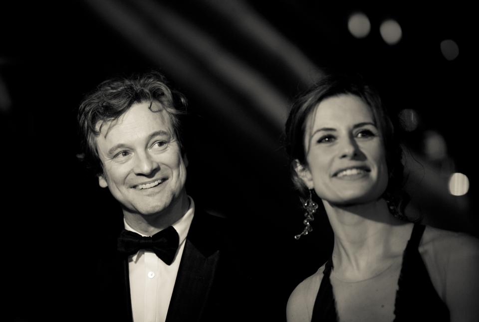 DUBAI, UNITED ARAB EMIRATES - DECEMBER 14: (EDITORS NOTE: Image has been converted to black and white) Actor Colin Firth with his wife Livia attend the 2012 Dubai International Film Festival, Dubai Cares and Oxfam "One Night to Change Lives" Charity Gala at the Armani Hotel on December 14, 2012 in Dubai, United Arab Emirates. (Photo by Gareth Cattermole/Getty Images for DIFF)