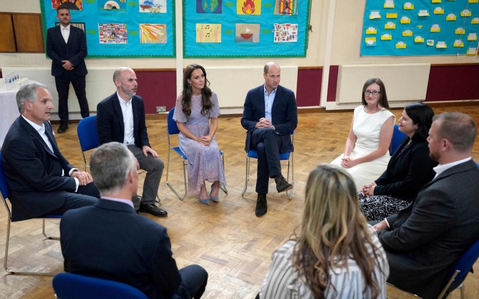The Prince and Princess of Wales speak with partners and supporters during a visit to housing charity Jimmy's in Cambridge on June 23, 2022 - FRANK AUGSTEIN/AFP