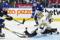 Toronto Maple Leafs' Jake McCabe, left, is stopped by Boston Bruins goaltender Jeremy Swayman (1) during second-period action in Game 6 of an NHL hockey Stanley Cup first-round playoff series in Toronto, Thursday, May 2, 2024. (Nathan Denette/The Canadian Press via AP)