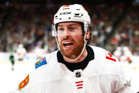 Dec 15, 2018; Saint Paul, MN, USA; Calgary Flames left wing James Neal (18) reacts on the ice in the third period during the game against the Minnesota Wild at Xcel Energy Center. Mandatory Credit: David Berding-USA TODAY Sports