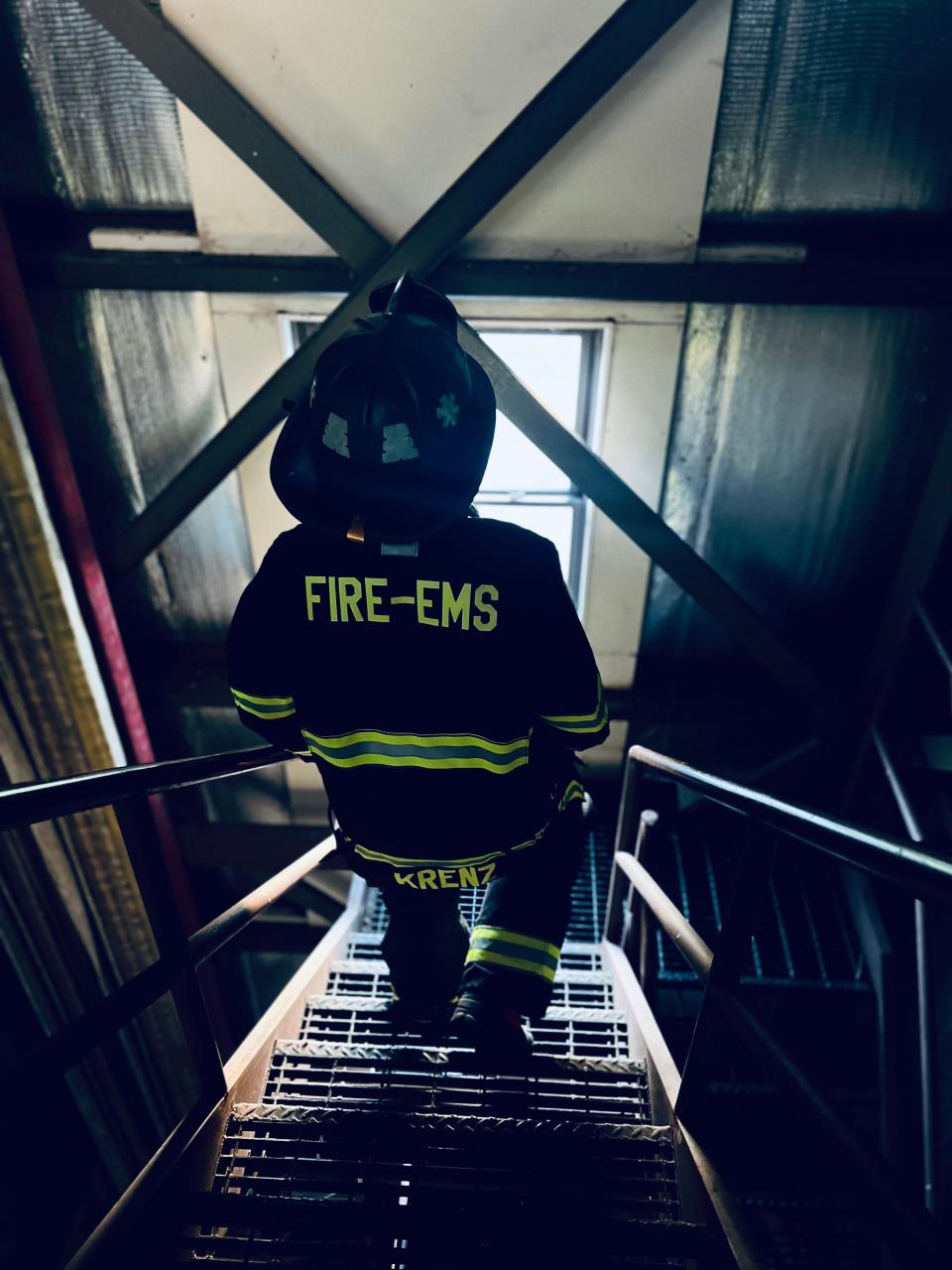 Madison Krenz, who has been a firefighter since 2019, is shown prior to entering a window. Some females may be smaller and able to enter more confined spaces.