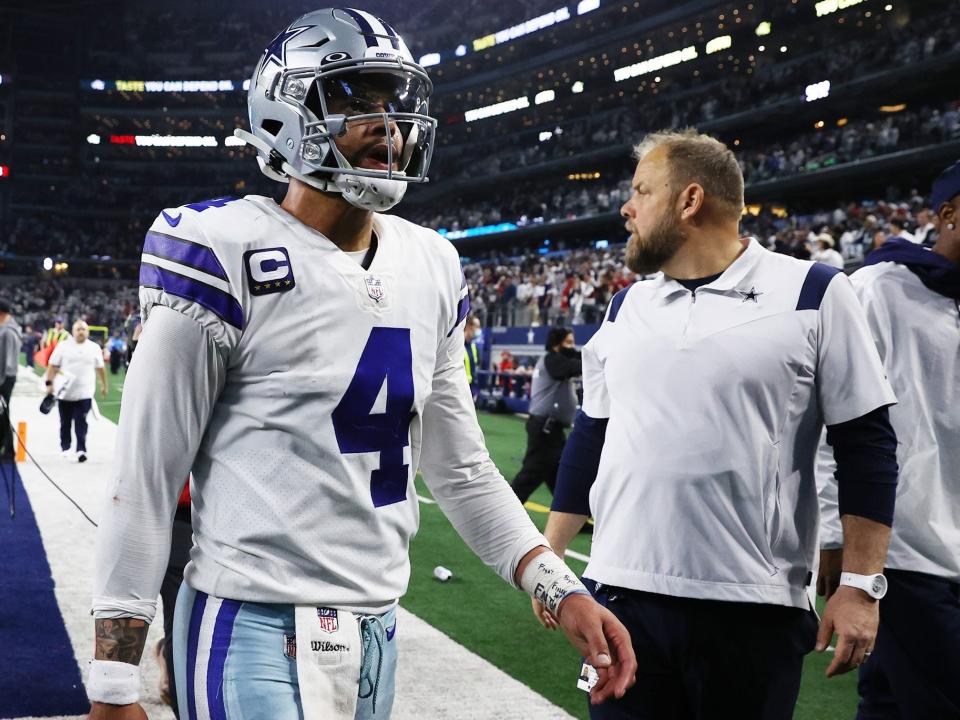 Dak Prescott walks off the field after a loss against the San Francisco 49ers.