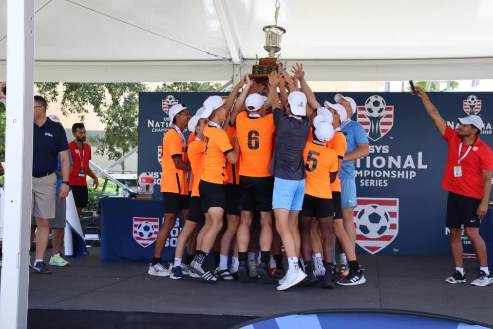 The U16 CUP Gold team celebrates their USYS national championship in Orlando.