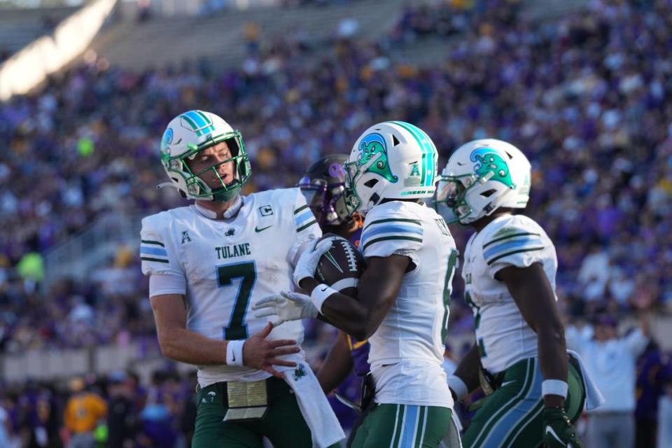 Nov 4, 2023; Greenville, North Carolina, USA; Tulane Green Wave wide receiver Lawrence Keys III (6) is congratulated by quarterback Michael Pratt (7) after his touchdown during the first half at Dowdy-Ficklen Stadium.