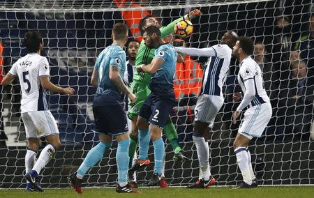 Britain Football Soccer - West Bromwich Albion v Swansea City - Premier League - The Hawthorns - 14/12/16 West Brom's Ben Foster attempts to clear the ball from Swansea's Jordi Amat Reuters / Peter Nicholls Livepic