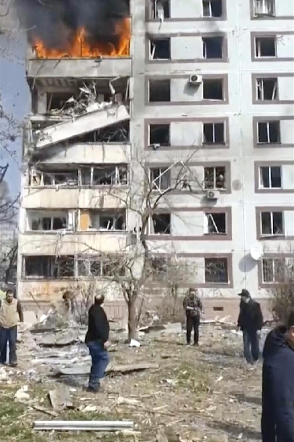 In this grab taken from video provided by Ukrainian Presidential Office, a residential multi-story building hit by a missile is on fire in southeastern city of Zaporizhzhia, Ukraine, Wednesday, March 22, 2023. (Ukrainian Presidential Office via AP)