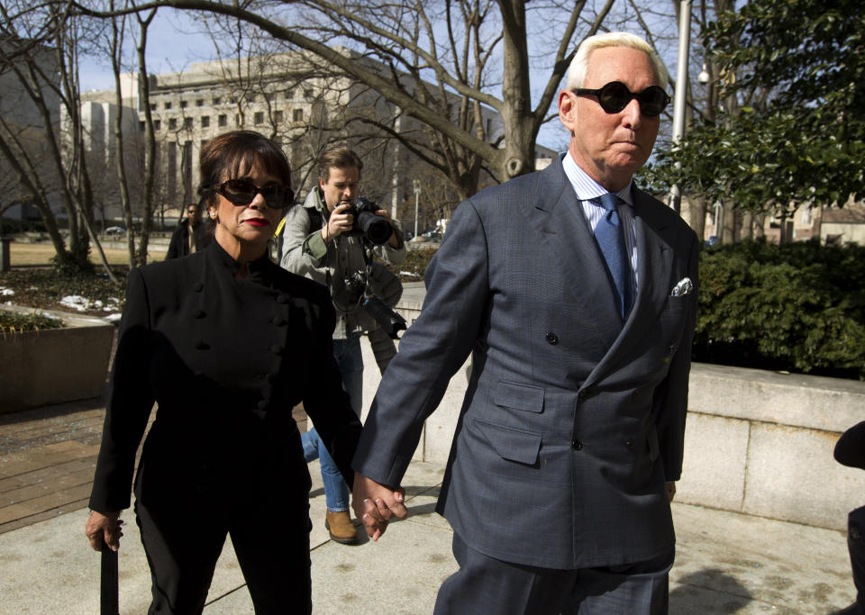 Former campaign adviser for President Donald Trump, Roger Stone accompanied by his wife Nydia Stone, left, arrives at federal court in Washington, Thursday, Feb. 21, 2019. Stone was ordered to appear in court over a Instagram post he made about U.S. Judge Amy Berman Jackson. (AP Photo/Jose Luis Magana)