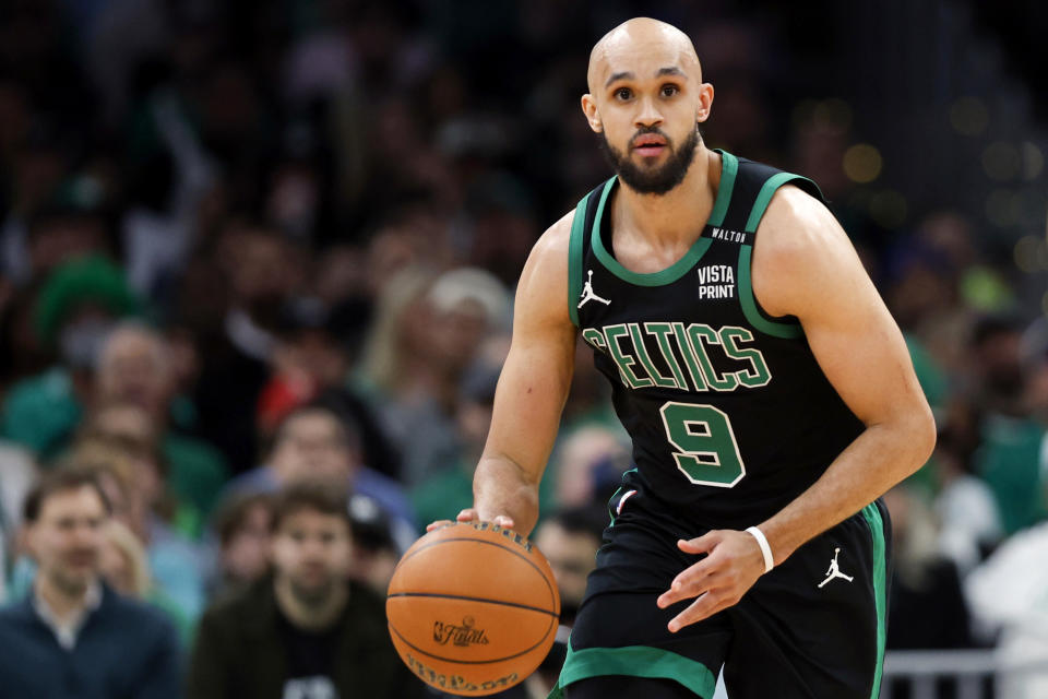 Boston, MA - June 9: Boston Celtics guard Derrick White dribbles during Game 2 of the 2024 NBA Finals. (Photo by Danielle Parhizkaran/The Boston Globe via Getty Images)