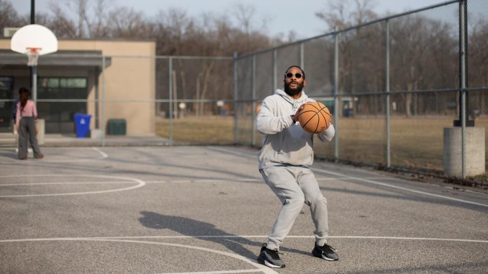 Rakeim Cain shoots hoops at Optimist Memorial Park on an unseasonably warm February afternoon, Monday, Feb. 26, 2024. 