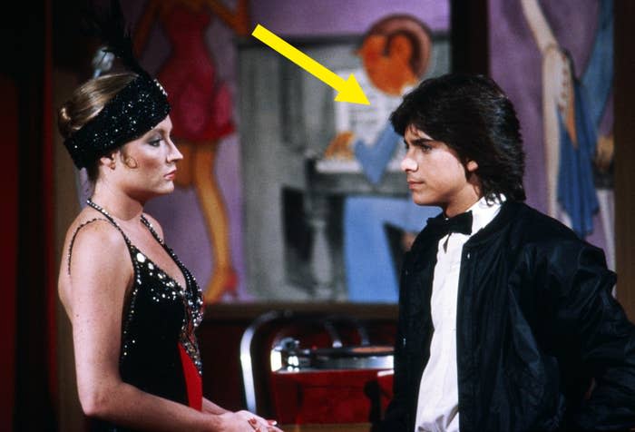 John in a tuxedo standing next to a woman in a scene "General Hospital"