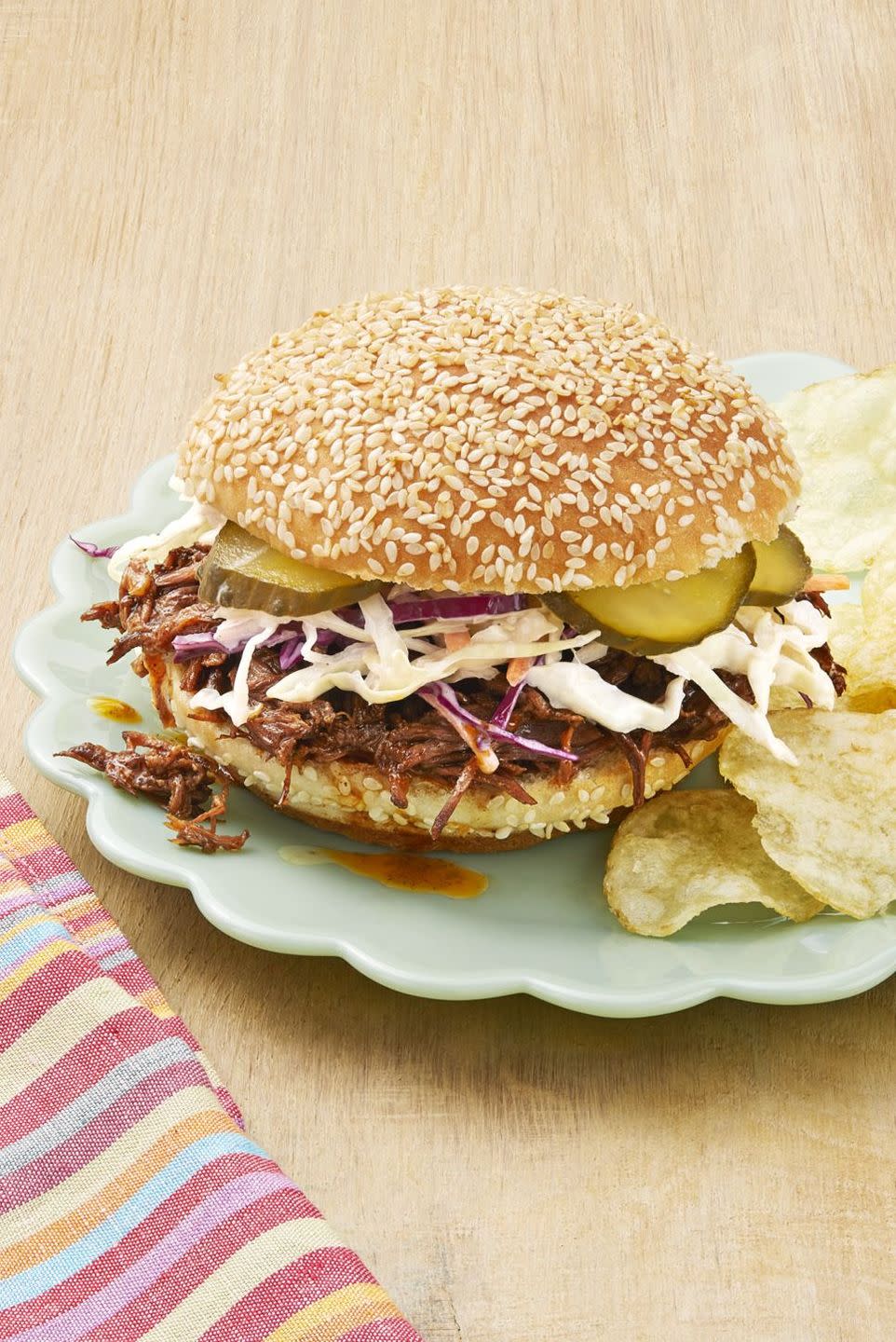 instant pot bbq beef sandwiches on plate with chips