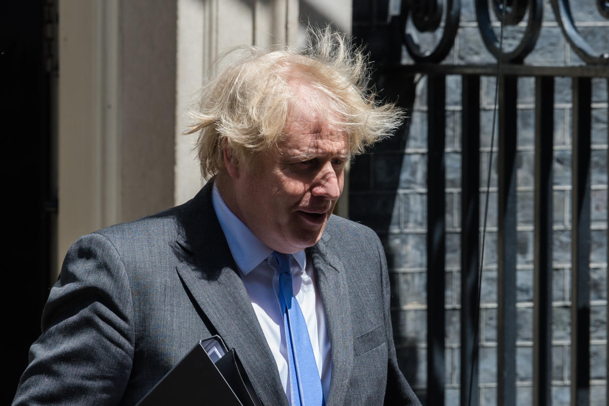 British Prime Minister Boris Johnson leaves 10 Downing Street for the House of Commons to deliver a statement  outlining the next steps of easing coronavirus restrictions on 23 June, 2020 in London, England. The Prime Minister is expected to announce measures to re-open pubs, hotels, restaurants, cinemas, art galleries and hairdressers likely to be allowed to operate from 4th July, as well as a reduction in the 2 metre social distancig rules. (Photo by WIktor Szymanowicz/NurPhoto via Getty Images)
