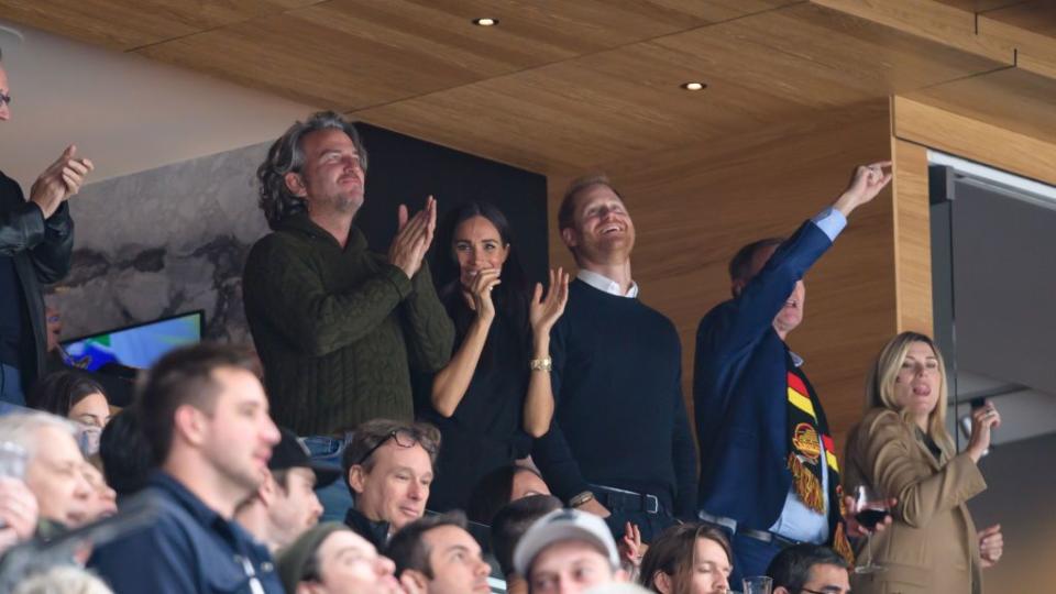 vancouver, canada november 20 prince harry, the duke of sussex, and meghan markle, the duchess of sussex, celebrate a vancouver canucks goal during the third period of the nhl game against the san jose sharks at rogers arena on november 20, 2023 in vancouver, british columbia, canada photo by derek caingetty images