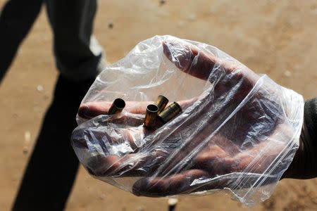 Four shell casings are shown after gunfire was heard during a protest against the Dakota Access pipeline near the Standing Rock Indian Reservation in Mandan, North Dakota, U.S. November 12, 2016. REUTERS/Stephanie Keith