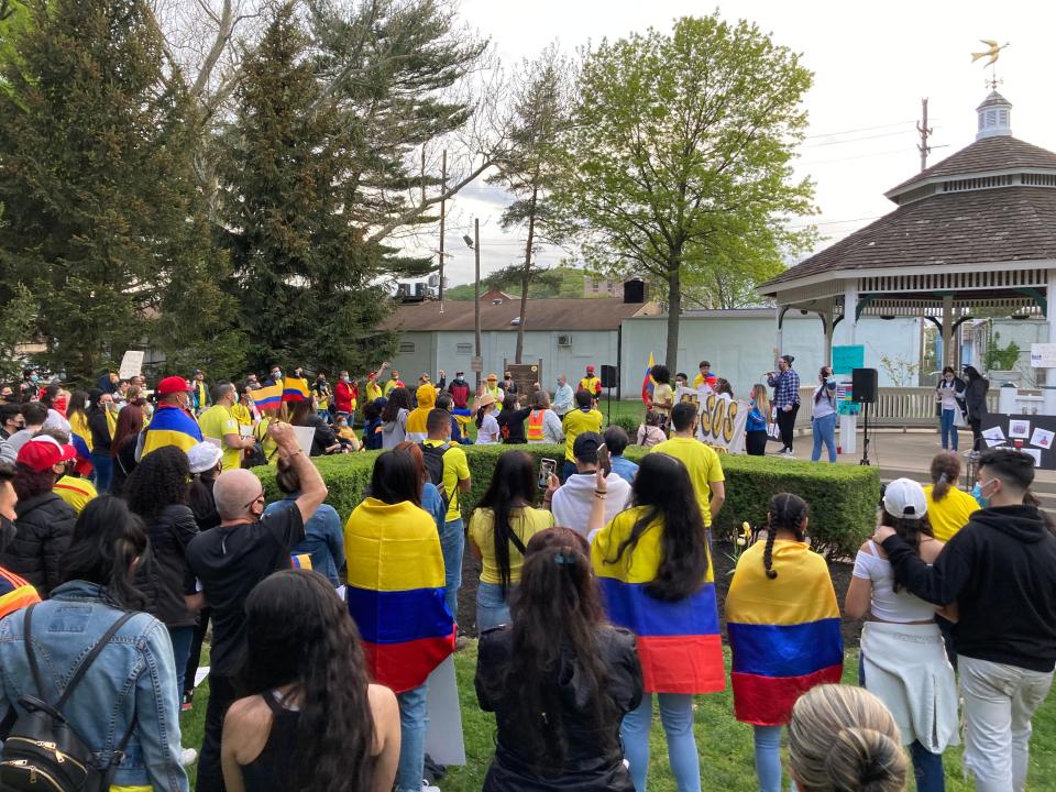 A few dozen people attended a rally in Dover on Friday to stand in solidarity with the residents of Colombia.