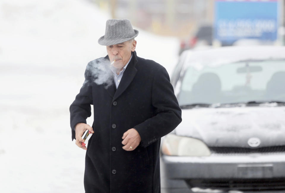 A man arrives at the funeral home prior to the visitation for Vito Rizzuto in Montreal