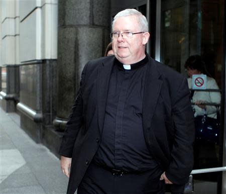 Monsignor William Lynn exits the courthouse for the day as the jury deliberates in his sexual abuse trial in Philadelphia, Pennsylvania, in this June 5, 2012, file photo. REUTERS/Tim Shaffer/Files