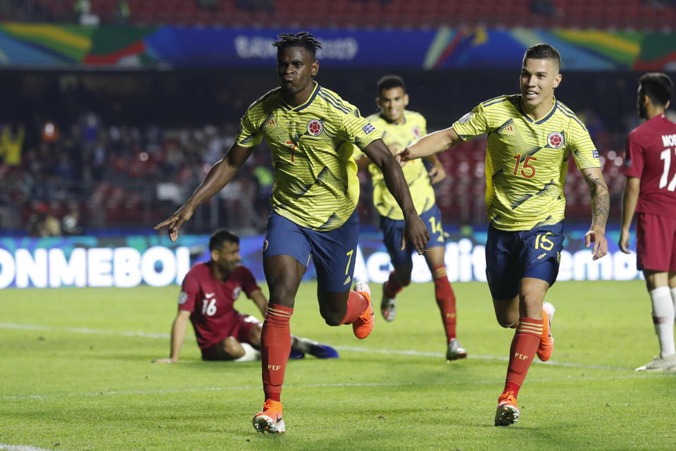 Colombia's Duvan Zapata, left, celebrates after scoring against Qatar with teammate Mateus Uribe during a Copa America Group B soccer match at the Morumbi stadium in Sao Paulo, Brazil, Wednesday, June 19, 2019. (AP Photo/Victor R. Caivano)