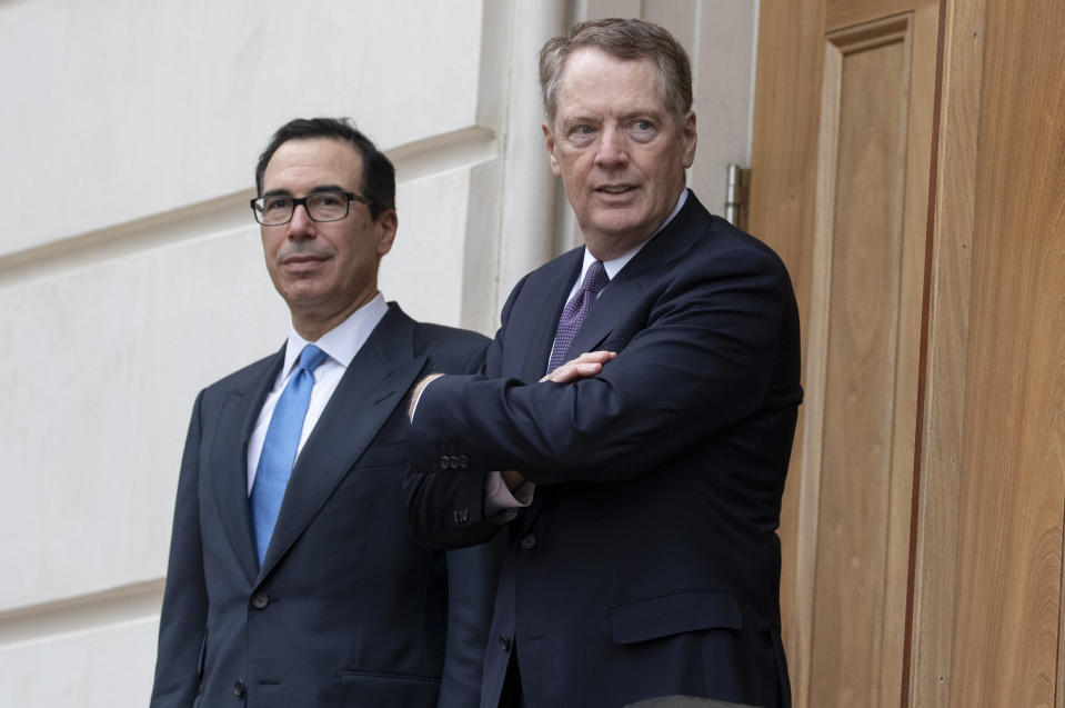 Robert Lighthizer, U.S. trade representative, right, and Steven Mnuchin, U.S. Treasury secretary, wait to greet Liu He, China's vice premier, not pictured, outside the Office of the U.S. Trade Representative in Washington, D.C., U.S., on Friday May 10, 2019. President Donald Trump boosted tariffs Friday on $200 billion in goods from China and threatened to impose more in his most dramatic steps yet to extract trade concessions, saying there's "no need to rush" a deal even though the uncertainty is roiling markets and clouding the global economy. Photographer: Alex Edelman/Bloomberg via Getty Images