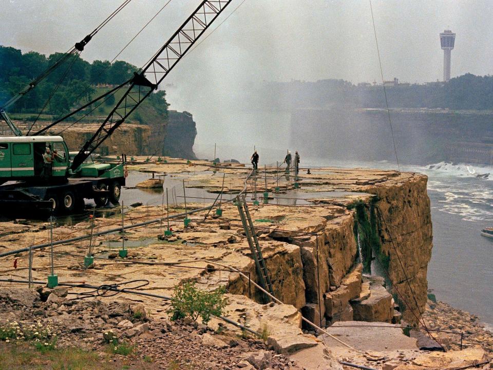 Workers are seen atop the dried up American Falls, which had been dried up to just a trickle in 1969.