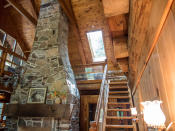 <p>Bateman says the fireplace provides ample heat in the cottage, making it a cozy getaway all year long. (Team Haliburton Highlands at RE/MAX) </p>