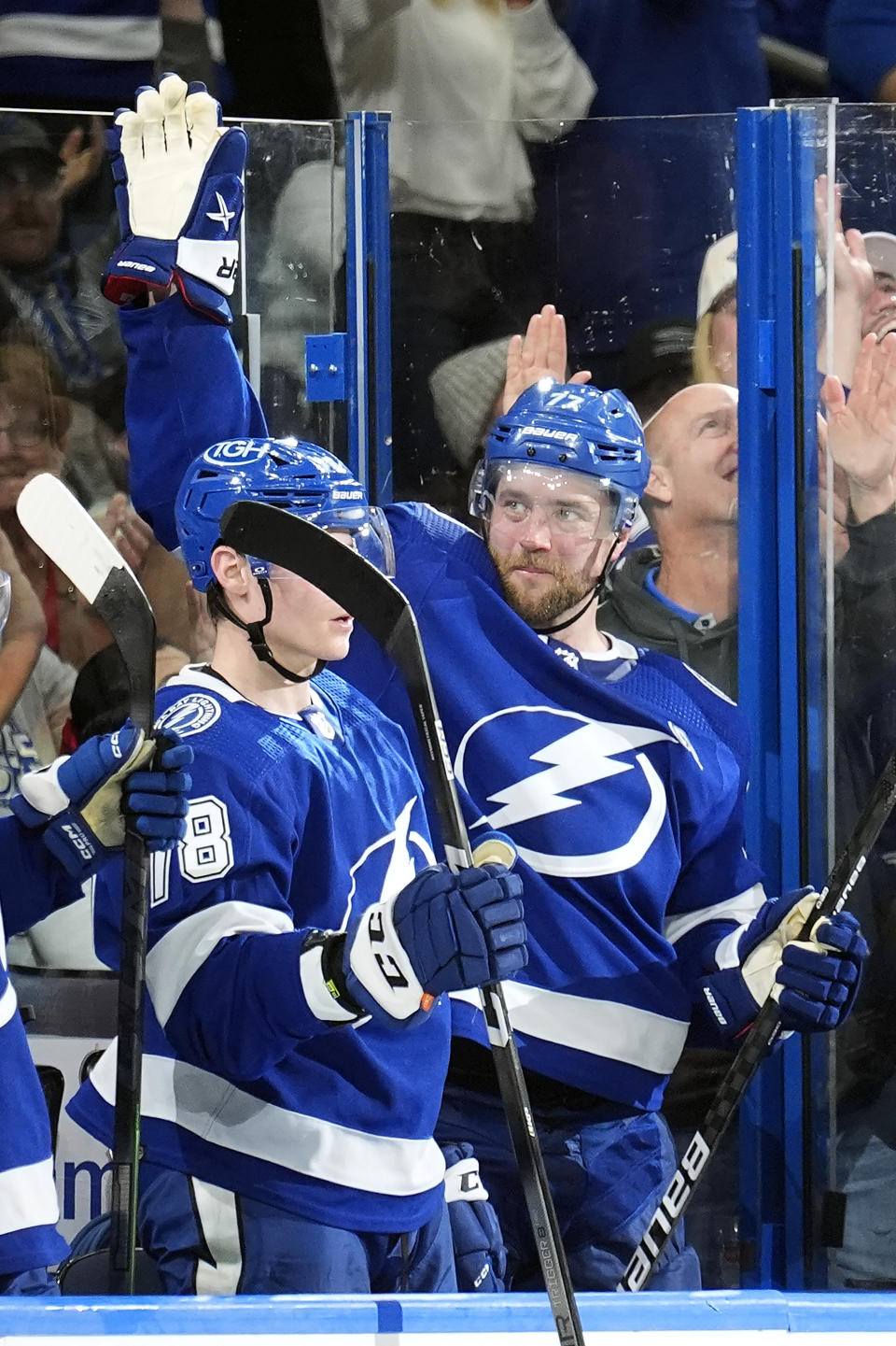 Tampa Bay Lightning defenseman Victor Hedman (77) waves to the crowd after a video tribute for his 700th career point during the second period of an NHL hockey game against the New Jersey Devils Saturday, Jan. 27, 2024, in Tampa, Fla. (AP Photo/Chris O'Meara)