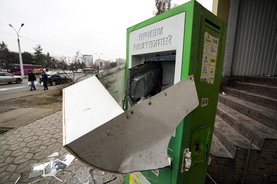 A broken services payment machine is seen on the street in Almaty, Kazakhstan, Tuesday, Jan. 11, 2022. Life in Almaty, which was affected with the violence the most during protests, started returning to normal this week, with public transport resuming operation and malls reopening. (AP Photo)