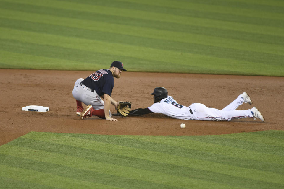 Miami Marlins Starling Marte attempt to beat the throw to second base during the first inning of a baseball game against the Boston Red Sox, Thursday, Sept. 17, 2020, in Miami. (AP Photo/Gaston De Cardenas)