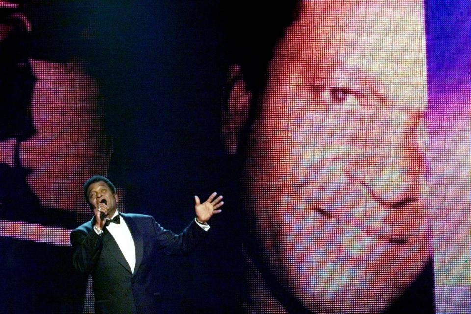 Charley Pride performs during the 34th CMA Awards show at the Grand Ole Opry House in 2000.