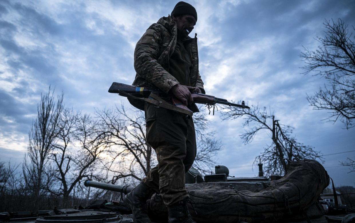 DONBAS REGION, UKRAINE, MARCH 15: A Ukrainian serviceman from the Special Operations Forces (OPFOR) 214 Brigade stands by his tank along the frontline north of Bakhmut, Ukraine on March 15, 2023. As the fight for Bakhmut continues, the Ukrainian government has send reinforcements in order to hold the city against the Russian forces. (Photo by Ignacio Marin/Anadolu Agency via Getty Images) - Ignacio Marin/Anadolu Agency via Getty Images