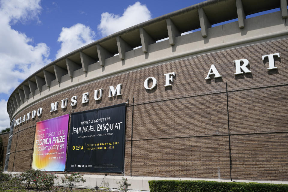 The exterior of the Orlando Museum of Art is seen where artist Jean-Michel Basquiat paintings were on display, Thursday, June 2, 2022, in Orlando, Fla. On Friday, June 24, 2022, the FBI raided the art museum and seized more than two dozen paintings attributed to Basquiat following questions about their authenticity. (AP Photo/John Raoux)