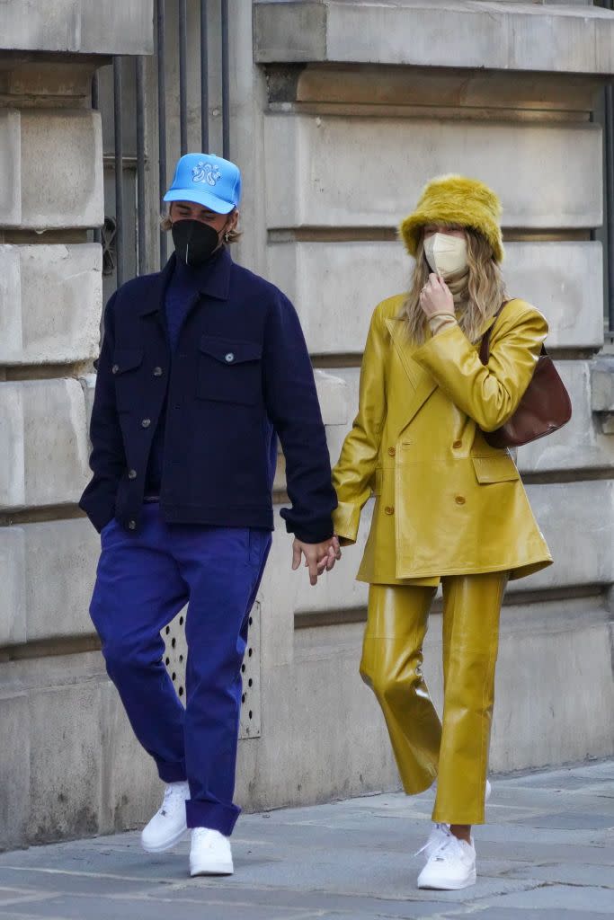 <p>While out in Paris (we're presuming for <a href="https://www.elle.com/uk/paris-fashion-week/" rel="nofollow noopener" target="_blank" data-ylk="slk:Paris Fashion Week;elm:context_link;itc:0;sec:content-canvas" class="link ">Paris Fashion Week</a>), the Biebers clashed in colour-drenched outfits. Justin wore all blue, while Hialey paired a mustard furry hat with matching shiny suit, both by Stand Studio with a handbag by By Far. They both wore crisp white Nike Air Force 1s.</p><p><a class="link " href="https://www.net-a-porter.com/en-gb/shop/designer/stand-studio/clothing" rel="nofollow noopener" target="_blank" data-ylk="slk:SHOP STAND STUDIO NOW;elm:context_link;itc:0;sec:content-canvas">SHOP STAND STUDIO NOW</a></p>