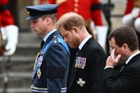 <p>TOPSHOT - Britain's Prince William, Prince of Wales (L) and Britain's Prince Harry (C), Duke of Sussex arrive at Westminster Abbey in London on September 19, 2022, for the State Funeral Service for Britain's Queen Elizabeth II. - Leaders from around the world will attend the state funeral of Queen Elizabeth II. The country's longest-serving monarch, who died aged 96 after 70 years on the throne, will be honoured with a state funeral on Monday morning at Westminster Abbey. (Photo by Marco BERTORELLO / AFP) (Photo by MARCO BERTORELLO/AFP via Getty Images)</p> 