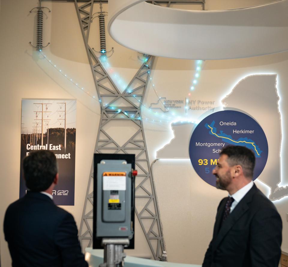 From left, President and CEO of New York State Power Authority Justin E. Driscoll and CEO of LS Power Paul Segal light up a transmission tower to signify the completion of the Central East Energy Connect transmission project in Utica, NY on Wednesday, December 13, 2023.