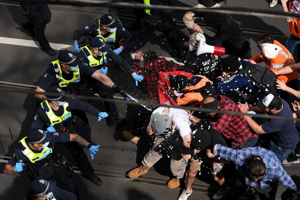 Victoria Police clash with protesters during ‘The Worldwide Rally for Freedom’ in Melbourne (EPA)