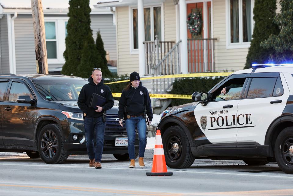 Stoughton police detectives Daniel Barber and Sandra Barrett at the homicide scene on Park Street where a woman's body was found in an outbuilding behind a house on Tuesday, Dec. 13, 2022.