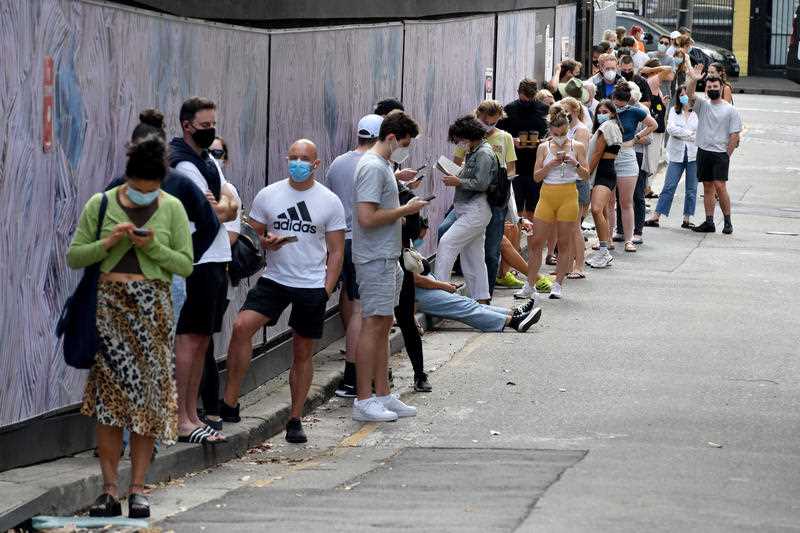 Members of the public queue for Covid-19 PCR tests at a clinic in Redfern in Sydney