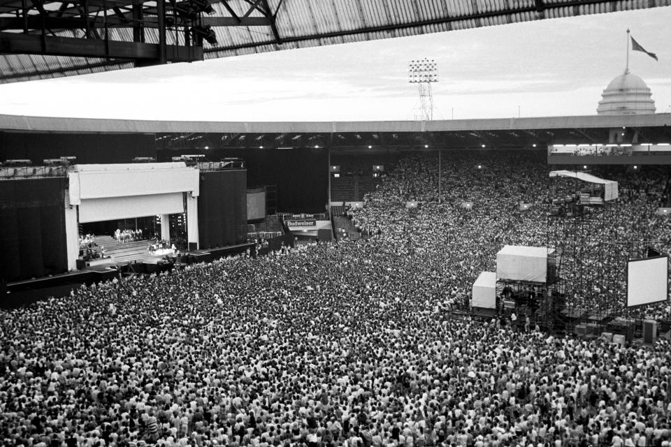 Seventy seven thousand Madonna fans make a human sea at Wembley Stadium tonight as the American superstar took to the stage for her first London concert.